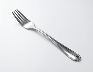 A stainless steel fork lays diagonally on a white surface, showing its tines and reflective qualities