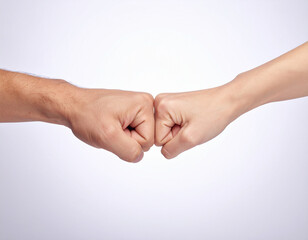 Two hands pushing against each other over a product.