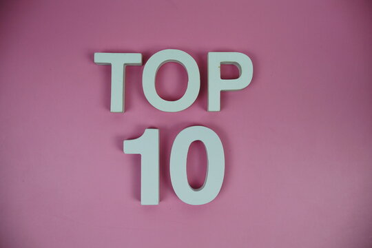 Top 10 alphabet letters top view on pink background
