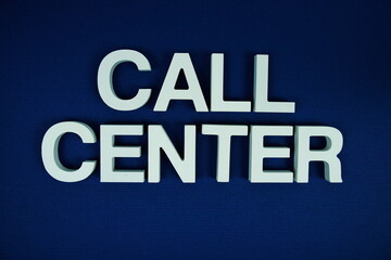 Call Center alphbet letters top view on navy blue background