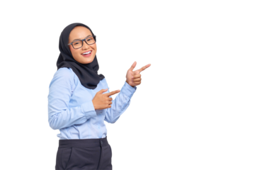 Portrait of smiling young Asian woman pointing finger at copy space isolated on transparent background