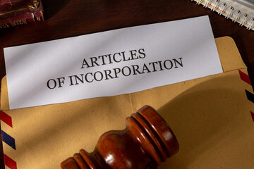 Incorporation Papers Emerging from Envelope on Executive Desk