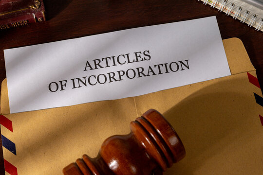 Incorporation Papers Emerging from Envelope on Executive Desk