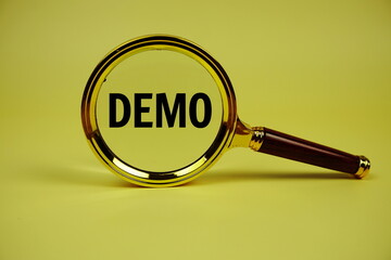 Demo text with magnifying glass on yellow background