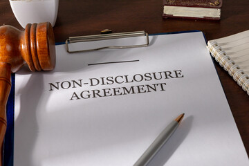 NDA Document Paper on Desk with Judge’s Gavel