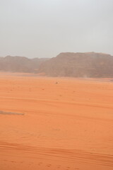 Wadi Rum Desert, Jordan. The red desert and Jabal Al Qattar mountain. 8th July 2023. On a hot spring cloudy day. 