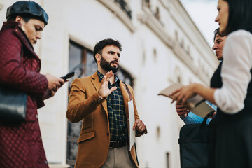 Fototapeta premium A group of business people engaged in conversation in an urban area, sharing ideas and information. The meeting captures a moment of collaboration and communication among colleagues in a city