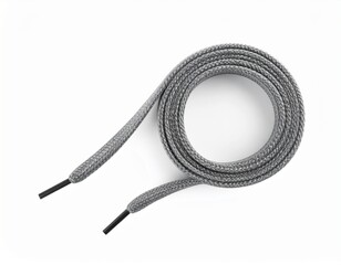 Gray shoelace curled on white, showcasing its texture and ends, simple and functional