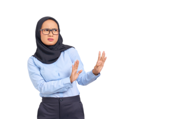 Portrait of annoyed young Asian woman crossing hands makes stop gesture, demonstrates rejection isolated on transparent background