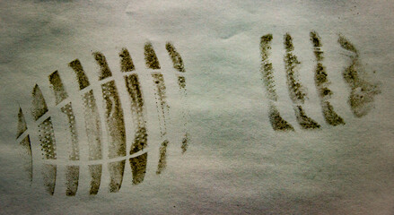 Shoe print on white surface