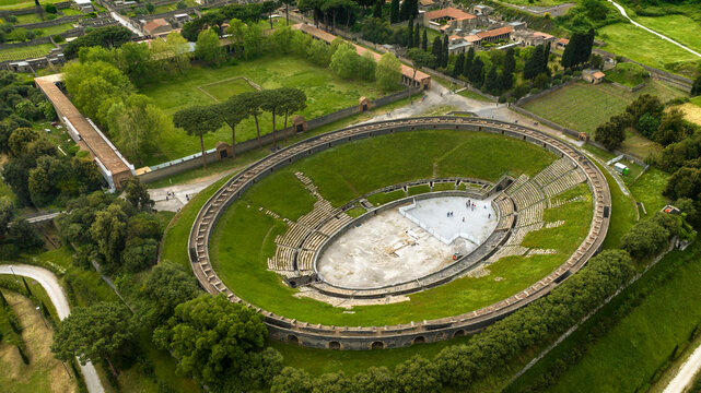 Aerial view of the Pompeii amphitheater and Large Palaestra (also known as the Great Gymnasium) located in the archaeological park of the ancient Roman city in the province of Naples, Campania, Italy.