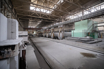 Industrial production of aerated concrete blocks, AAC blocks (Autoclaved aerated concrete), Fly ash or Grey Cement Fly Ash Bricks. Autoclaves and trolleys with cut blocks. General view of the workshop
