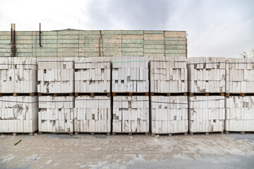 Industrial production of aerated concrete blocks, AAC blocks (Autoclaved aerated concrete). Finished products are placed on wooden pallets. Lowest grade products, on sale.