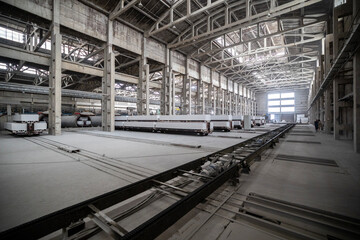 Industrial production of aerated concrete blocks, AAC blocks (Autoclaved aerated concrete), Fly ash or Grey Cement Fly Ash Bricks. Autoclaves and trolleys with cut blocks. General view of the workshop
