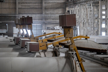 Industrial production of aerated concrete blocks, AAC blocks (Autoclaved aerated concrete), Fly ash or Grey Cement Fly Ash Bricks. Autoclaves and trolleys with cut blocks. General view of the workshop