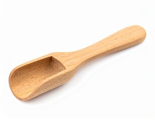 Light-colored wooden scoop with a handle, lying on a white surface, angled slightly