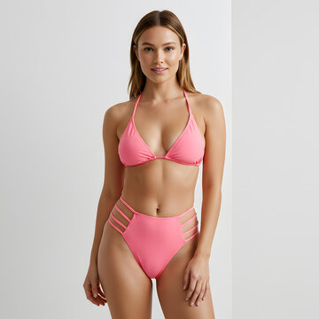 young woman model showcasing diverse stylish bikini , studio fashion photography for e-commerce.

