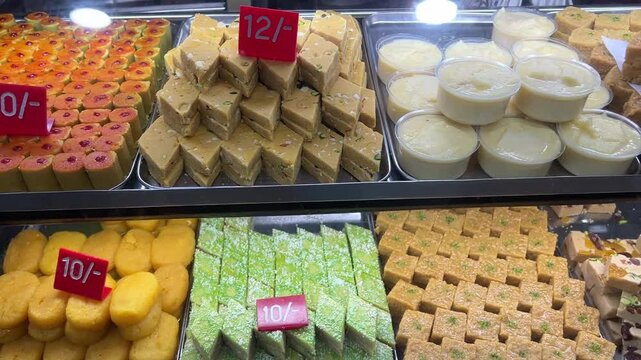 Different types of Bengali sweets like Indrani, peda kept in a showcase in Kolkata.