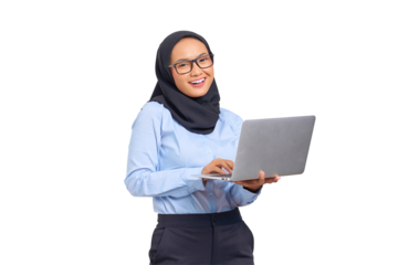 Portrait of smiling young Asian woman holding a laptop and looking at camera isolated on transparent background