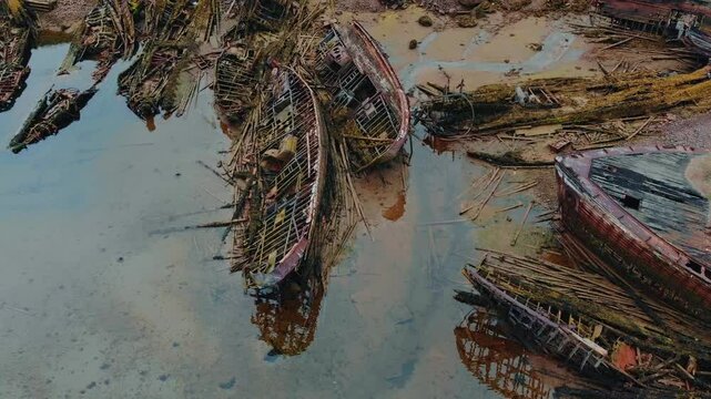 Aerial top view Cemetery of old ships in Teriberka Murmansk Russia, dramatic mood.