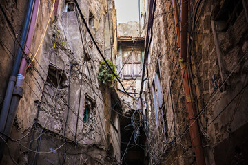  Narrow street and old houses in the center of Tripoli old town, Lebanon