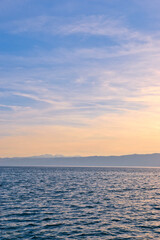 Lake Ohrid, North Macedonia, April 13 2024. Mountain range and peninsula in distance. Ohrid Lake, Macedonia, Europe. The clear mesmerizing waters of lake Ohrid with a beautiful view. 