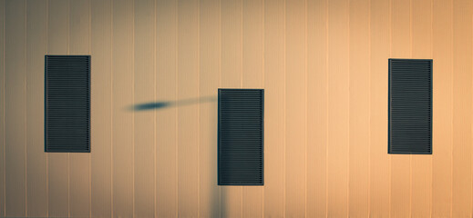 Symmetrical architectural background playing with three windows