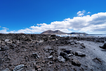 White town on the island of Lanzarote. Volcanic landscape of the Spanish island with houses.