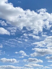 Cumulus clouds in the sky. Vertical image.