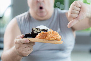 Starting healthy eating; overweight person says no to eat junk food