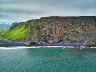 Aerial scenic view of Reynisfjara black sand beach near Vik in Southern Iceland.