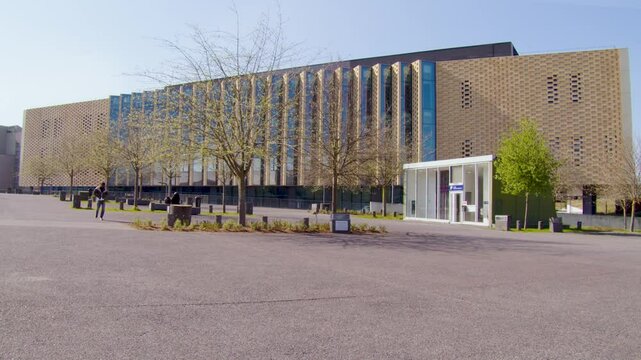Video footage of the Robert Schuman Convention Center in Metz, France, captured from the Parvis des Droits de l&rsquo;Homme. Modern architecture, public space, and urban landscape in northeastern France.