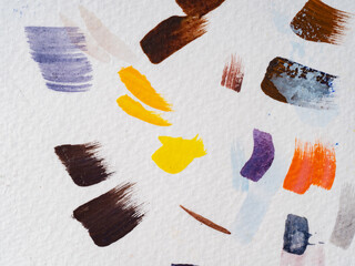 colored paint strokes on white paper