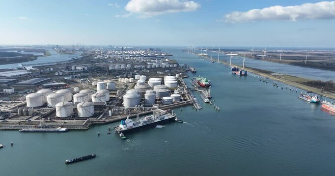 Europoort, Rotterdam, tank, storage silos, fossil fuels and energy, shipping and transport industry over water. North Sea, The Netherlands. Aerial view.
