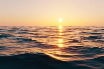 Obraz premium Golden light dances on gentle waves as the sun sets over a serene sea, creating a peaceful and cinematic atmosphere
