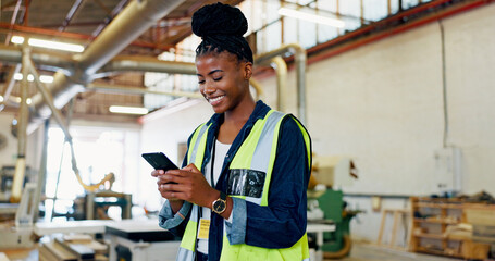 Phone, woman and happy engineer in factory for inventory, storage or text for furniture production. African worker, technology and carpenter in warehouse for manufacturing, woodwork and check stock