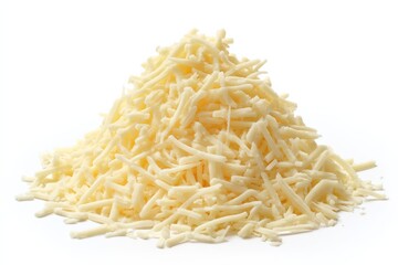 Fototapeta premium Freshly shredded cheese ready for cooking or topping dishes in a bright kitchen setting