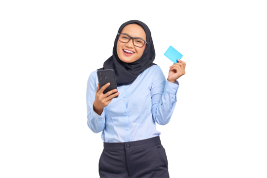 Portrait of cheerful young Asian woman holding mobile phone and showing credit card isolated on transparent background