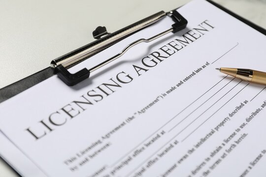 Licensing agreement document on white table, closeup