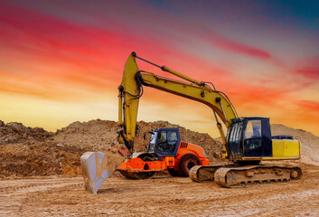 Soil Compactor the leveling soil at construction site. Excavator and vibration single-cylinder road...