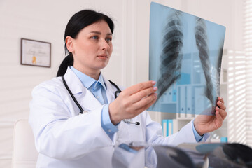 Doctor examining lung MRI scan in clinic