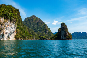 Fototapeta premium Tropical rainforest Mountain peak in Thailand, Beautiful archipelago islands Thailand Scenic mountains in the lake in Khao Sok National Park, Amazing nature landscape