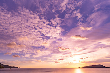 Nature beautiful light sunset or sunrise over sea surface,Colorful sunset sky with clouds and waves in the ocean,Wide angle sea background