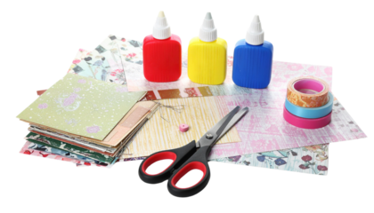 Scrapbooking supplies including scissors, patterned paper, and glue sticks isolated on white in Png format