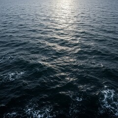 Fototapeta premium Dark Blue Ocean Water With Sunlight Glimmer