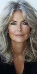 Fototapeta premium Portrait of a Beautiful and Confident Mature Woman with Gray Hair, Isolated on White Background