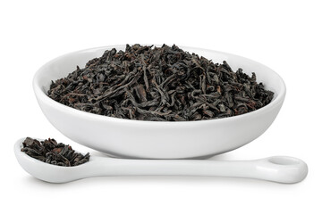 Dry black tea leaves in ceramic bowl isolated on white background