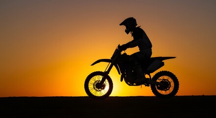 Motorcycle riding silhouette at sunset