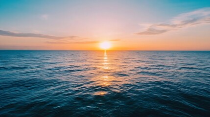 Obraz premium Serene ocean sunset: golden sun dips below horizon, casting warm light on tranquil blue water, creating a peaceful and picturesque scene. : Generative AI