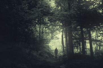 man silhouette in dark fantasy forest